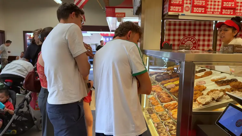 Max and Armand tasting donuts in the Los Angeles area