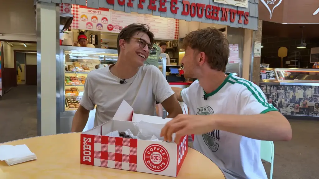 Max and Armand trying donuts during a Los Angeles food tour