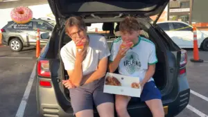 Max and Armand trying American donuts in Los Angeles