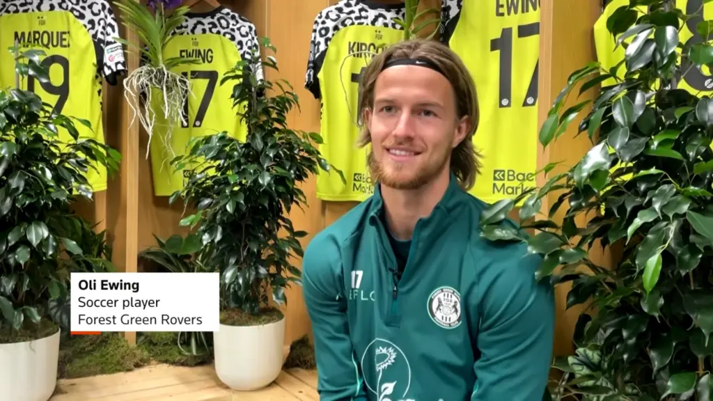 Forest Green Rovers player interviewed near the plants in the changing room