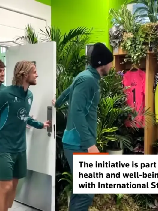Forest Green Rovers football players entering their dressing room transformed with lush greenery and houseplants