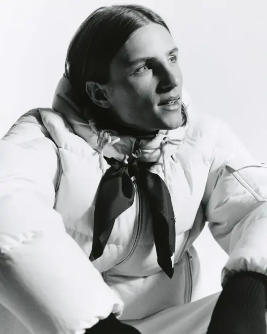 Indiana van’t Slot in a light quilted Moncler puffer jacket with a dark neckerchief for Re/Icons 2026