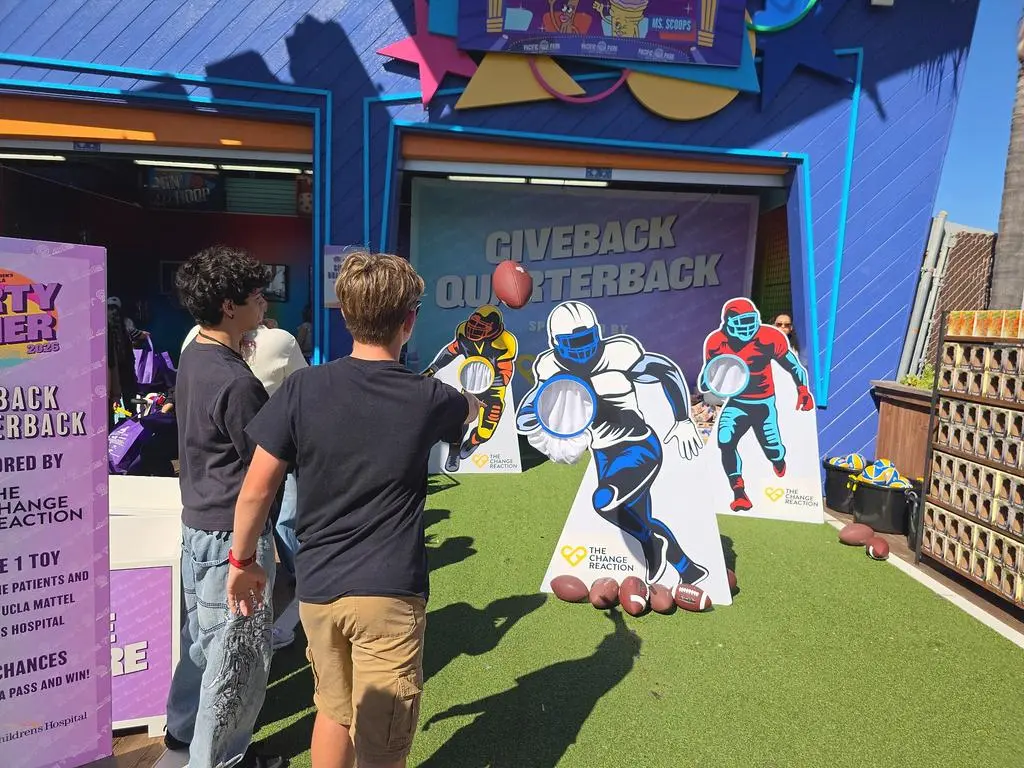 Isaac Ordonez by the Giveback Quarterback football toss at Pacific Park