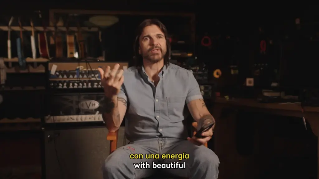 Juanes reflecting on moments from his music career in a video retrospective