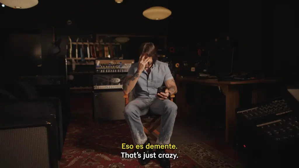 Juanes reflecting on moments from his music career in a video retrospective