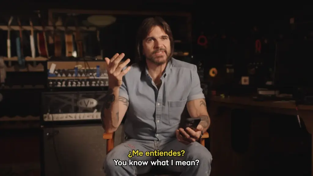 Juanes reflecting on moments from his music career in a video retrospective