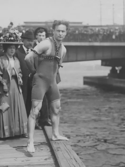 Historical black-and-white portrait of Harry Houdini, the legendary magician and escape artist