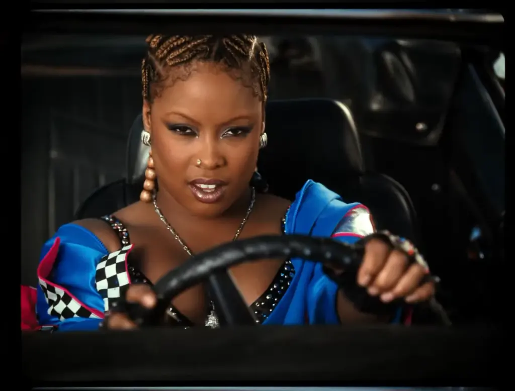 Da Brat driving in the restored Loverboy Remix music video