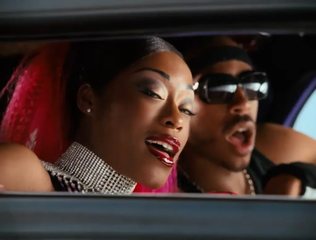 Ludacris and Shawnna riding in a car in the restored Loverboy Remix music video