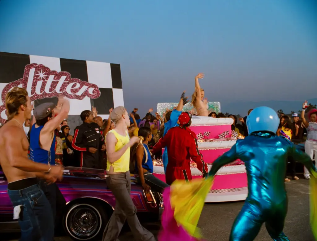 Mariah Carey surrounded by a crowd in the restored Loverboy Remix music video