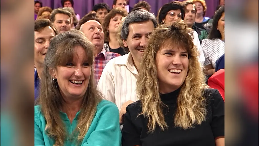 Smiling audience members watching Pee-wee Herman on The Joan Rivers Show