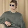 Leon Dame modeling RIMOWA x MYKITA HERITAGE MR007 round sunglasses in The Rehearsal eyewear campaign