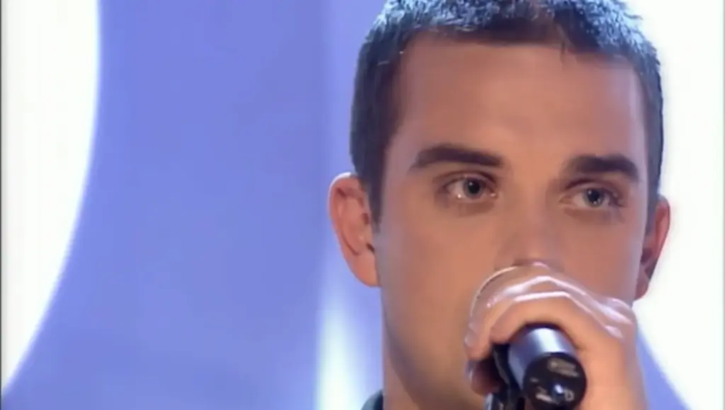 Robbie Williams during his Top of the Pops Christmas 1998 performance of Angels