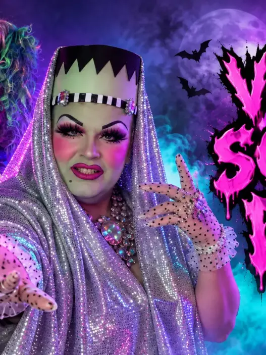 Delta Work in a glamorous Frankenstein-inspired drag look with silver sequins, neon fog, and “Very Scary Delta” Halloween title text.