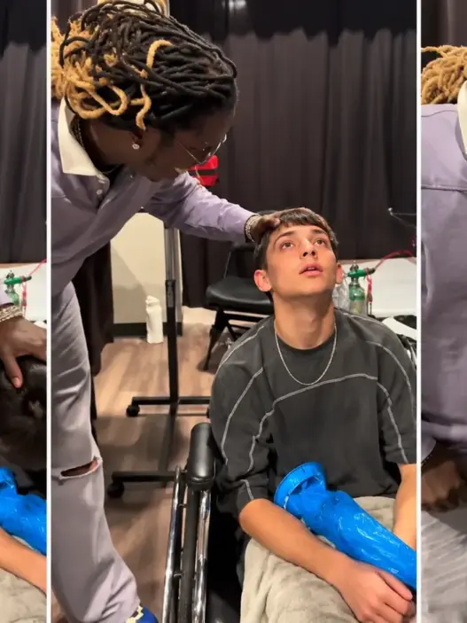 Young Thug with a concertgoer in a wheelchair backstage in Phoenix