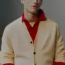 Supermodel Valentin Humbroich wearing a pink sweater with cobalt blue knitwear draped over his shoulders for Zara’s Color Coded Fall 2026 menswear edit.