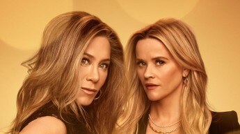 Jennifer Aniston and Reese Witherspoon pose in black outfits on promotional artwork for The Morning Show, with the series title and Apple TV+ logo visible.